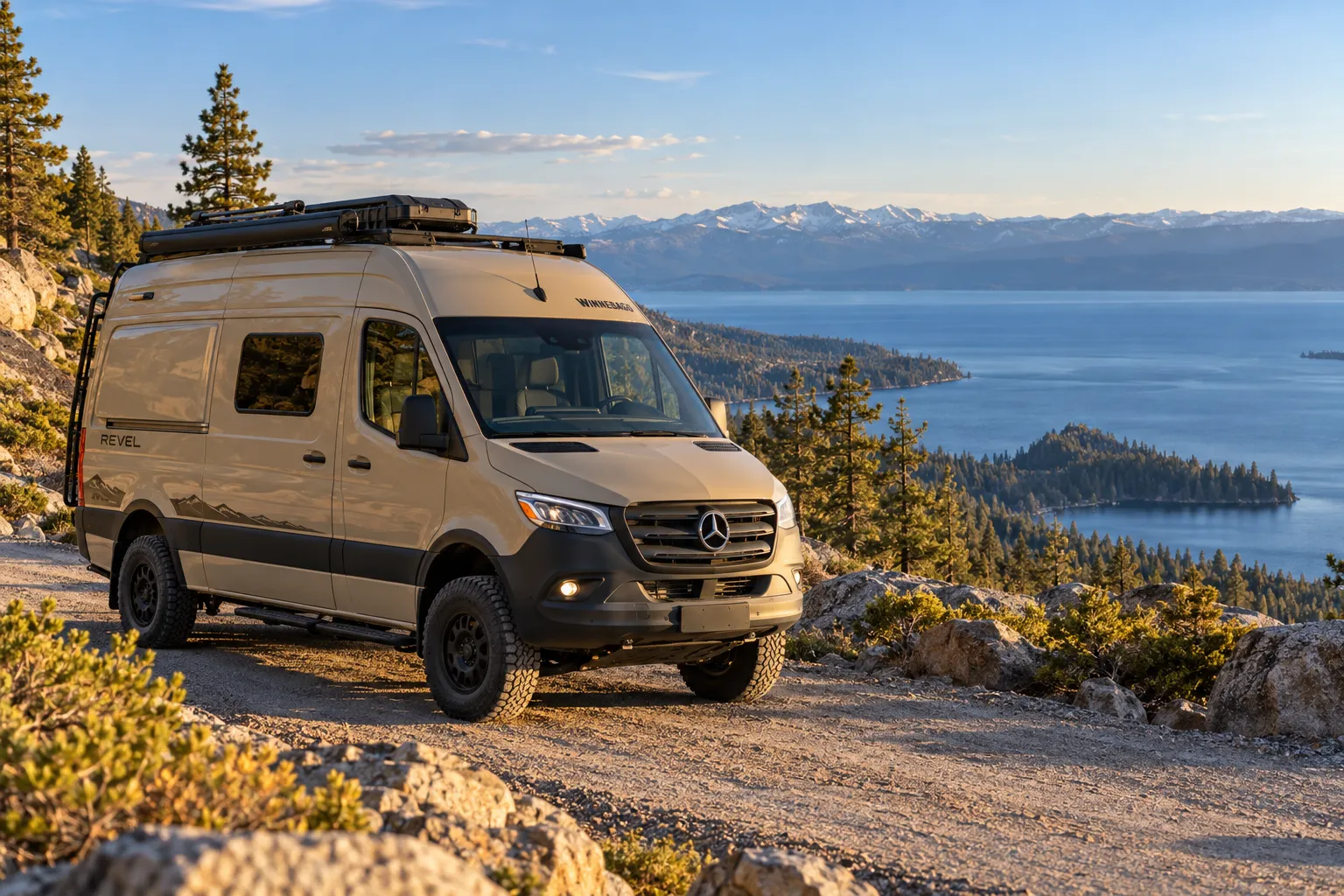 A Winnebago Revel on a dirt road above Lake Tahoe